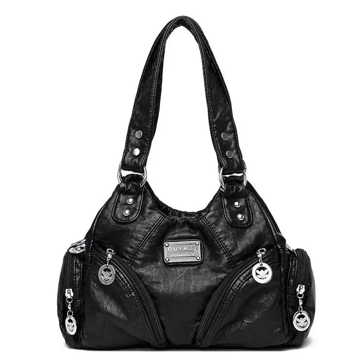 Black handbag with silver accents on a white background