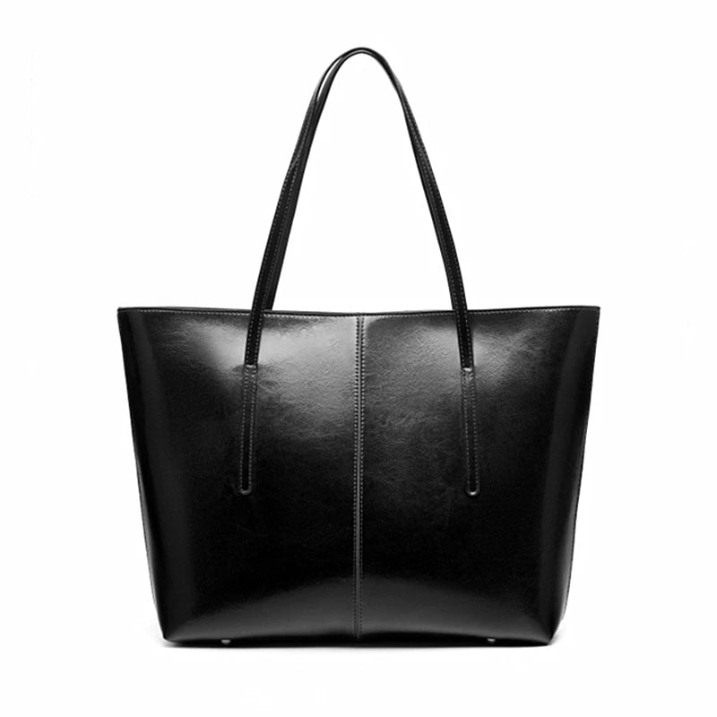 Black leather tote bag on a white background
