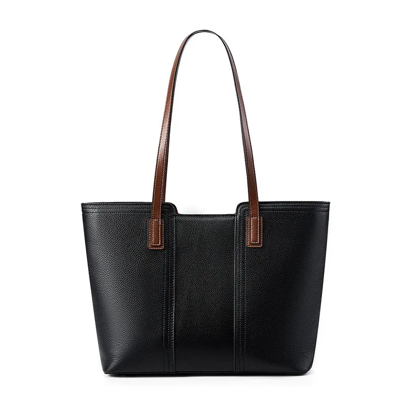 Black tote bag with brown handles on a white background