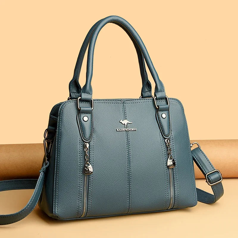 Blue handbag with a visible brand logo on a beige background