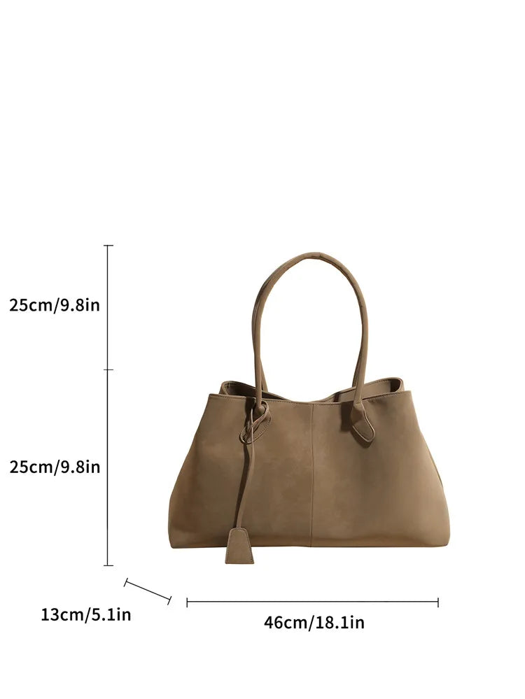 Brown handbag with dimensions indicated on a white background