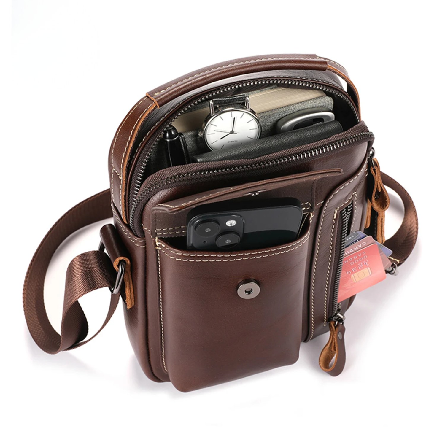Brown leather crossbody bag with compartments on a white background