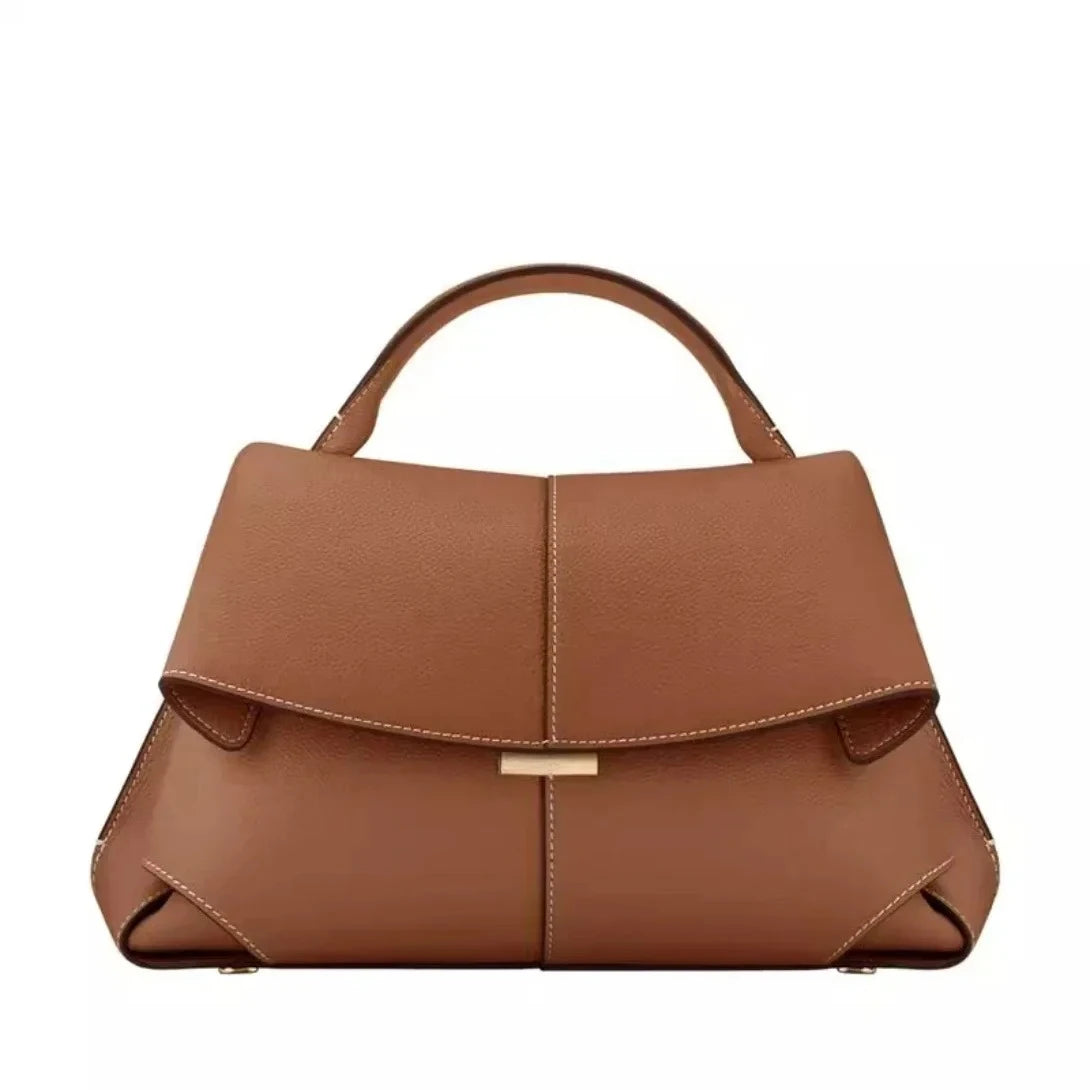 Brown leather handbag on a white background