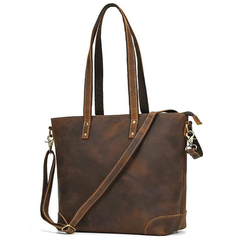Brown leather tote bag with shoulder strap on a white background