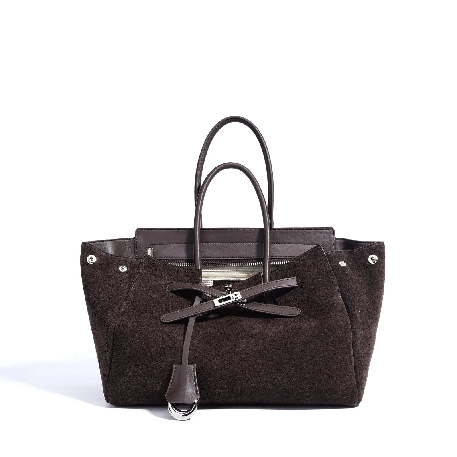 Brown suede handbag with black interior on a white background