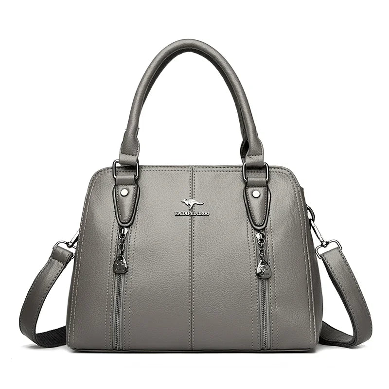 Gray handbag with a visible brand logo on a white background