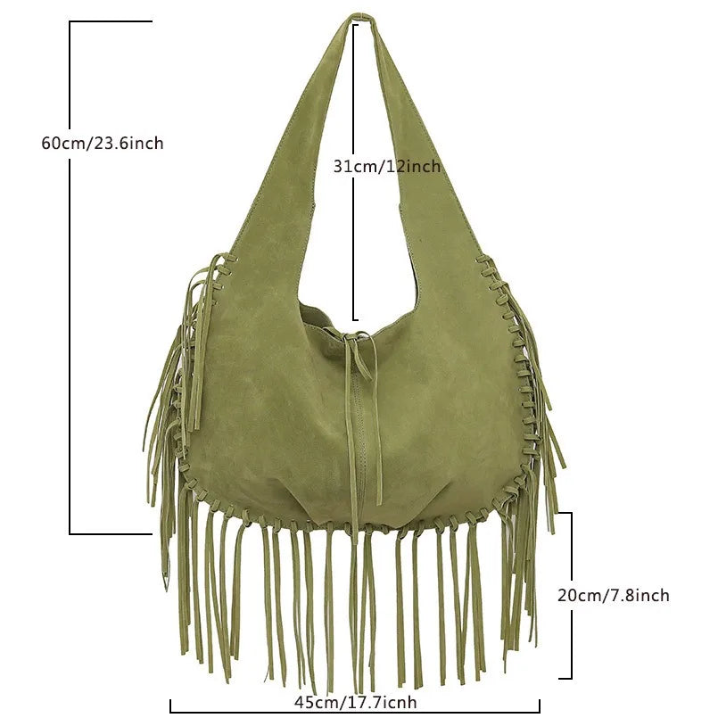 Green suede handbag with fringe details and measurements on a white background