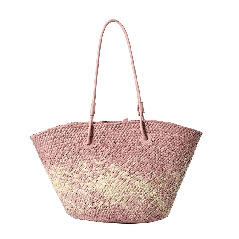 Pink woven handbag with a gradient effect on a white background