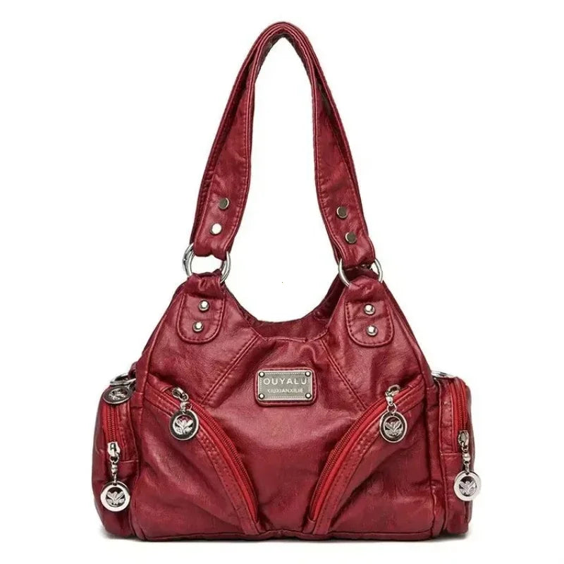Red handbag with silver accents on a white background