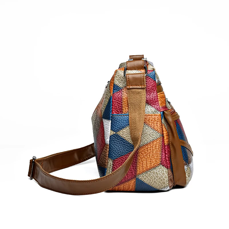 Side view of vintage PU leather shoulder bag with adjustable brown strap and patchwork pattern