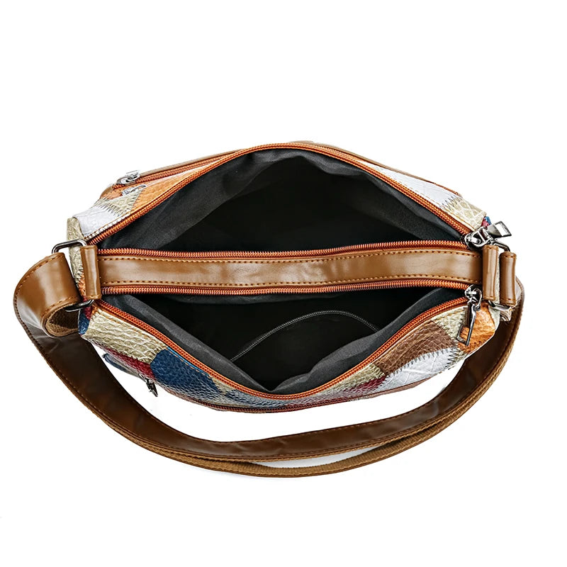 Inside view of vintage PU leather shoulder bag with spacious compartments and zippered pockets.