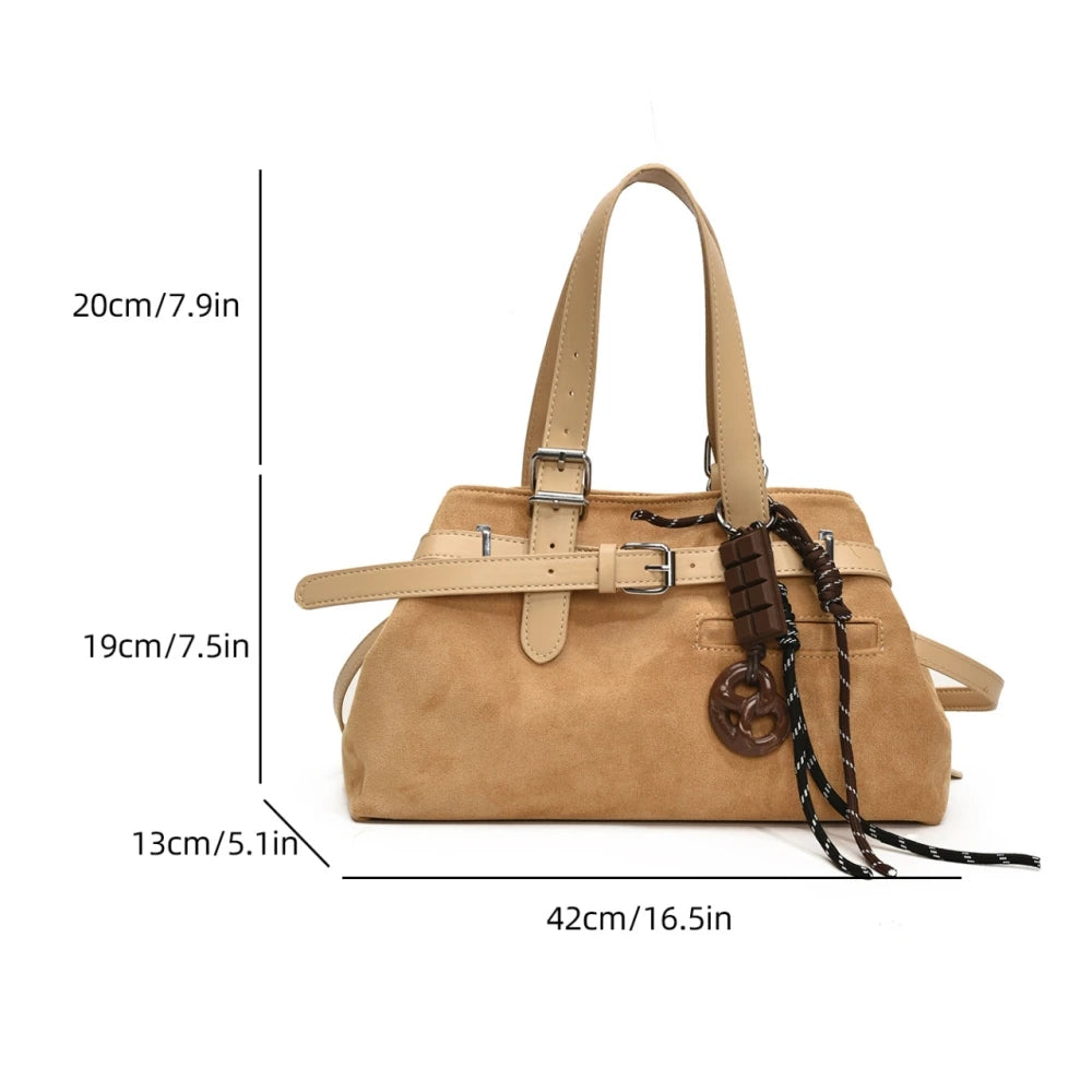 Tan handbag with measurements on a white background