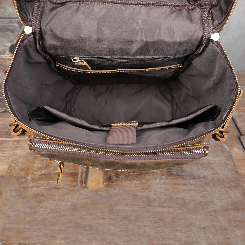 Vintage genuine leather backpack interior with padded laptop compartment and zip pocket