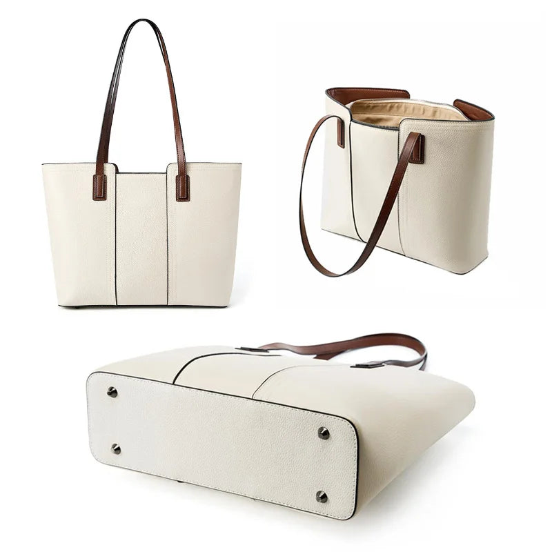 White handbag with brown handles and trim on a white background