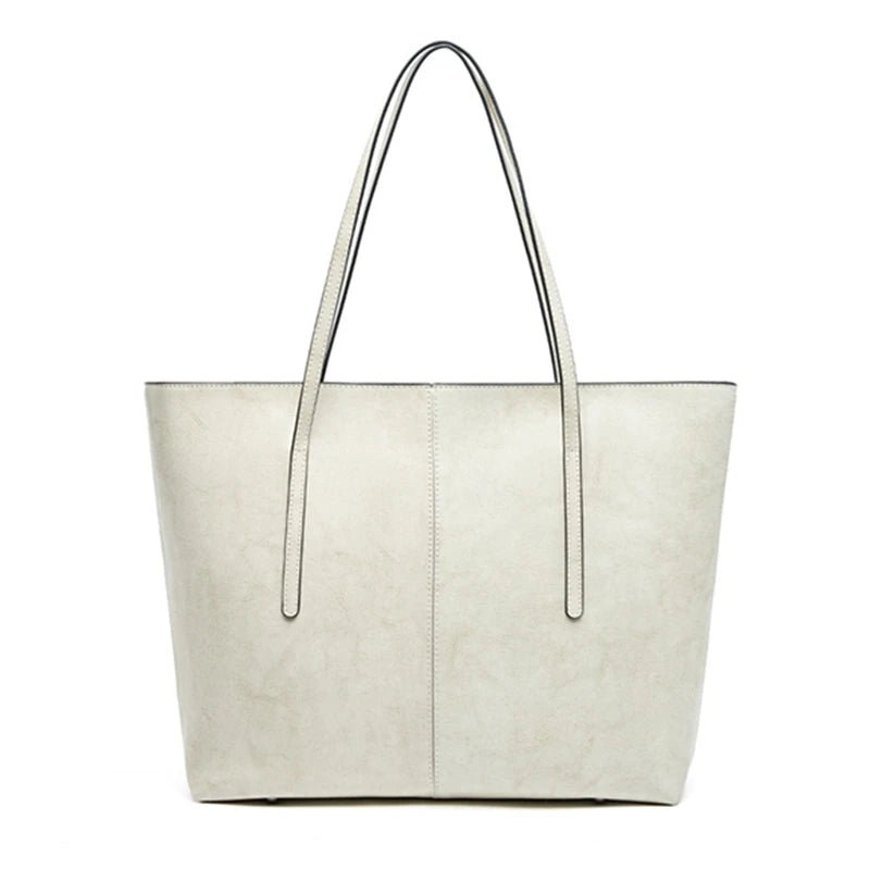 White tote bag with black handles on a white background