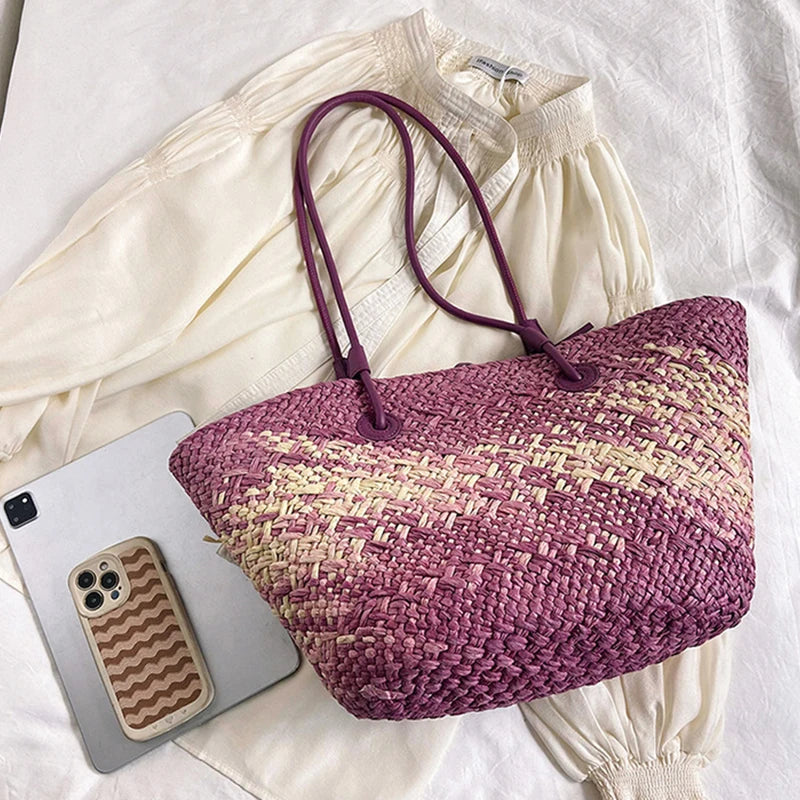 Woven pink bag with a phone and phone case on a white background