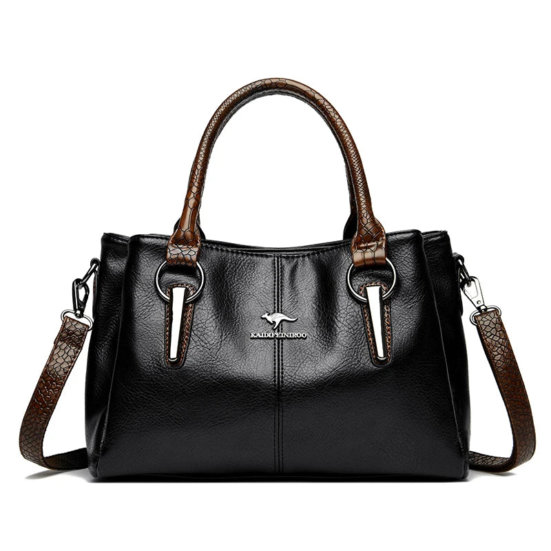 Elegant black leather handbag with brown crocodile-patterned handles and detachable shoulder strap.