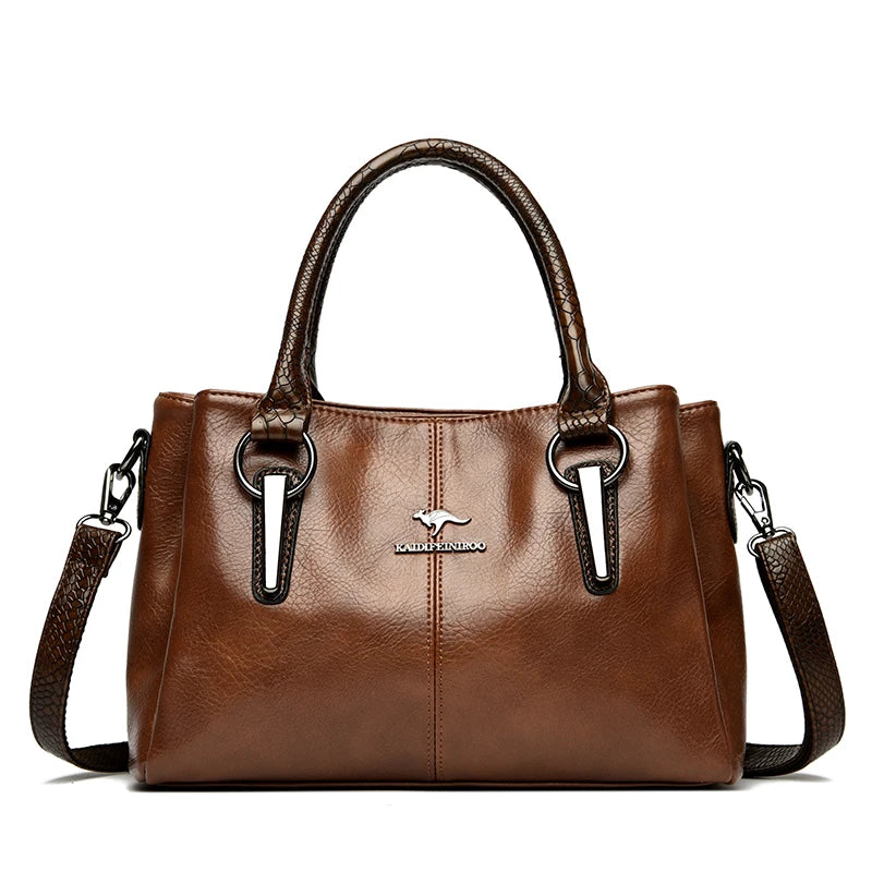  Elegant brown leather handbag with brown crocodile-patterned handles and detachable shoulder strap.