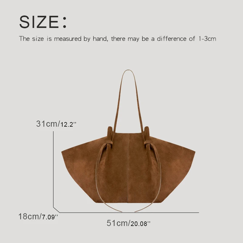 Brown handbag with measurements on a light gray background