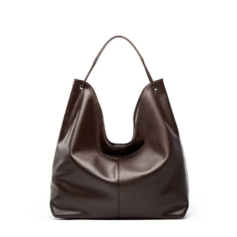 Brown leather handbag on a white background