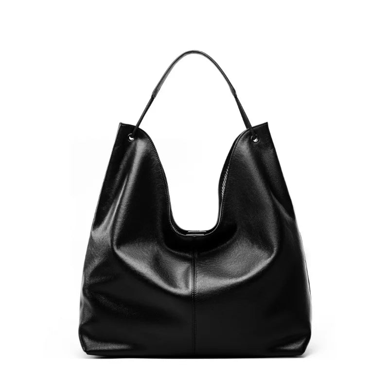 Black leather handbag on a white background
