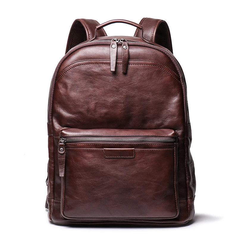 Brown leather backpack on a white background