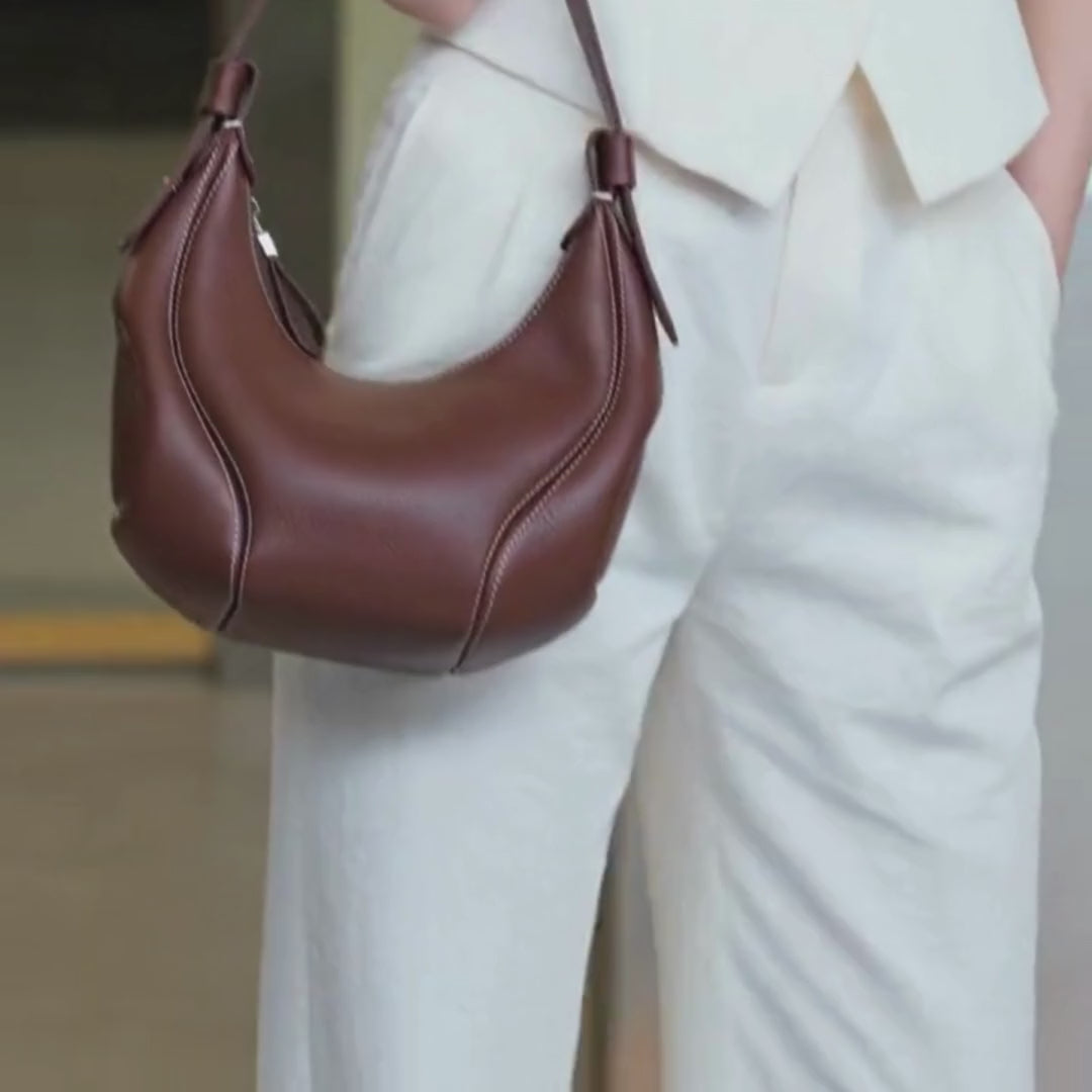 brown handbag video