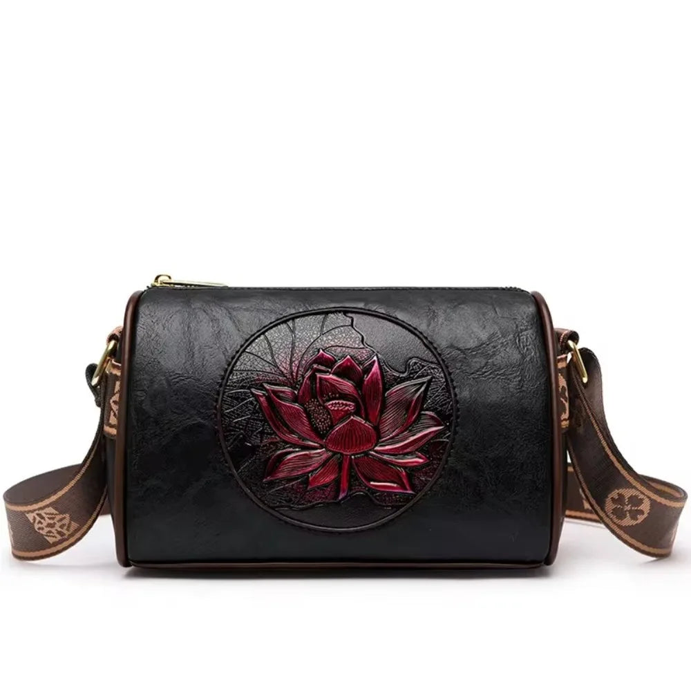 Vintage floral leather crossbody bag in black with an embossed red lotus design, featuring an adjustable decorative strap.
