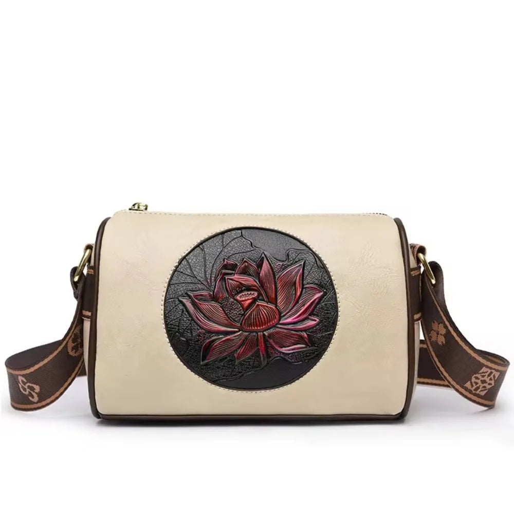 Vintage floral leather crossbody bag with embossed red lotus design on a beige background, featuring a decorative shoulder strap.